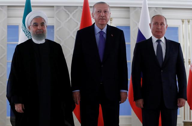 Presidents Hassan Rouhani of Iran, Tayyip Erdogan of Turkey and Vladimir Putin of Russia pose before their meeting in Ankara, Turkey, September 16, 2019. REUTERS/Umit Bektas/Pool