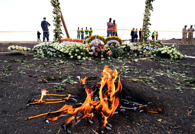 FILE PHOTO: Candle flames burn during a commemoration ceremony for the victims at the scene of the Ethiopian Airlines Flight ET 302 plane crash, near the town Bishoftu, near Addis Ababa, Ethiopia March 14, 2019. REUTERS/Tiksa Negeri/File Photo