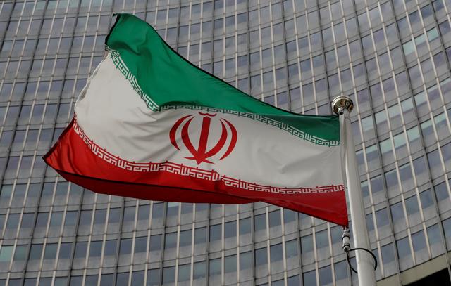 An Iranian flag flutters in front of the International Atomic Energy Agency (IAEA) headquarters in Vienna, Austria September 9, 2019.   REUTERS/Leonhard Foeger