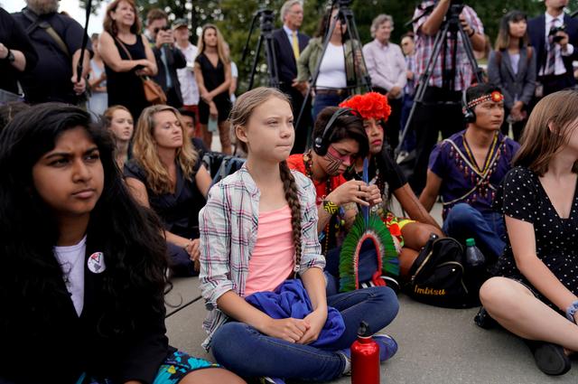 Sixteen year-old Swedish climate activist Greta Thunberg listens to speakers during a climate change demonstration at the U.S. Supreme Court in Washington, U.S., September 18, 2019. REUTERS/Kevin Lamarque