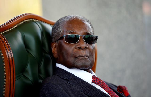FILE PHOTO: Zimbabwe's former president Robert Mugabe looks on during a press conference at his private residence nicknamed Blue Roof in Harare, Zimbabwe, July 29, 2018. REUTERS/Siphiwe Sibeko/File Photo