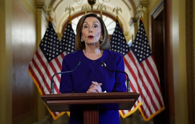 FILE PHOTO: House Speaker Nancy Pelosi (D-CA) announces the House of Representatives will launch a formal inquiry into the impeachment of U.S. President Donald Trump following a closed House Denocratic caucus meeting at the U.S. Capitol in Washington, U.S., September 24, 2019. REUTERS/Kevin Lamarque