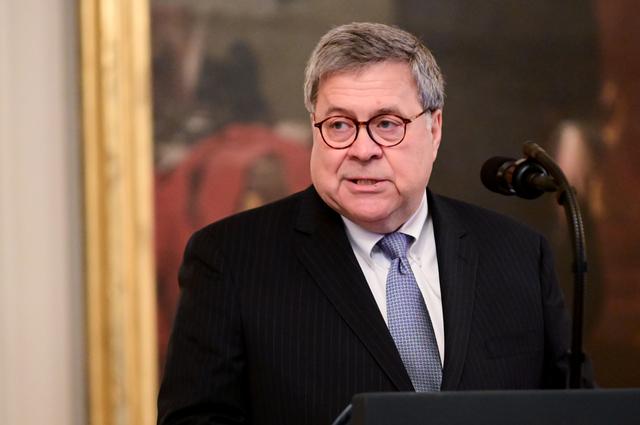 FILE PHOTO: U.S. Attorney General William Barr participates in a presentation ceremony of the Medal of Valor and heroic commendations to civilians and police officers who responded to mass shootings in Dayton, Ohio and El Paso, Texas during a ceremony in the East Room of the White House in Washington, U.S. September 9, 2019. REUTERS/Erin Scott