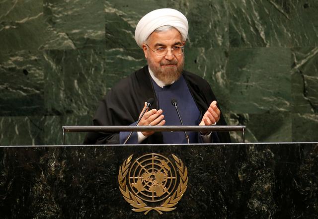FILE PHOTO: Iranian President Hassan Rouhani gestures at the conclusion of his address to the 69th United Nations General Assembly at the United Nations Headquarters in New York, September 25, 2014.  REUTERS/Mike Segar/File Photo
