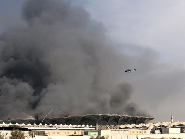 A firefighting helicopter sprays water on a fire at the Haramain high-speed rail station in Jeddah, Saudi Arabia, September 29, 2019. REUTERS/Ismail Nofal 