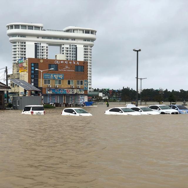 Cars are submerged in floodwater after Typhoon Mitag brought heavy rain and flood to Gangneung, South Korea, October 3, 2019, in this photo obtained from social media. @DIBIDIBOB/via REUTERS 