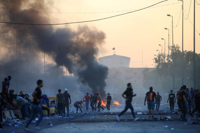 Demonstrators gather at a protest during a curfew, three days after the nationwide anti-government protests turned violent, in Baghdad, Iraq October 4, 2019. REUTERS/Alaa al-Marjani
