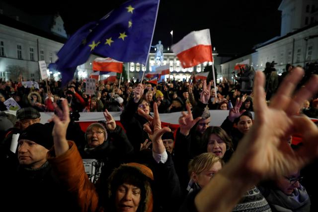 FILE PHOTO: People gather in front of the Presidential Palace during a protest against judicial reforms in Warsaw, Poland, November 24, 2017. REUTERS/Kacper Pempel/File Photo
