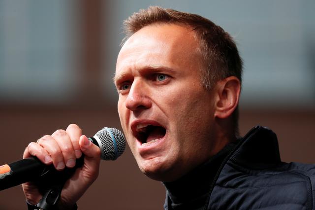 FILE PHOTO: Russian opposition leader Alexei Navalny delivers a speech during a rally to demand the release of jailed protesters, who were detained during opposition demonstrations for fair elections, in Moscow, Russia September 29, 2019. REUTERS/Shamil Zhumatov