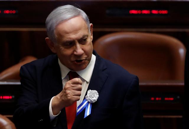 FILE PHOTO: Israeli Prime Minister Benjamin Netanyahu attends the swearing-in ceremony of the 22nd Knesset, the Israeli parliament, in Jerusalem October 3, 2019. REUTERS/Ronen Zvulun