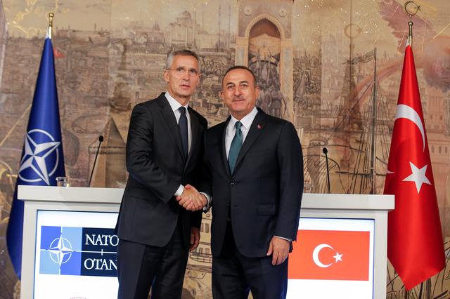 Turkish Foreign Minister Mevlut Cavusoglu shakes hands with NATO Secretary-General Jens Stoltenberg after a news conference in Istanbul, Turkey, October 11, 2019. REUTERS/Huseyin Aldemir