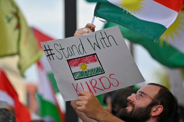A crowd of over 500 people protest in support of Kurds after the Trump administration changed its policy in Syria, in front of the federal courthouse in Nashville, Tennessee, U.S. October 11, 2019.  REUTERS/Harrison McClary