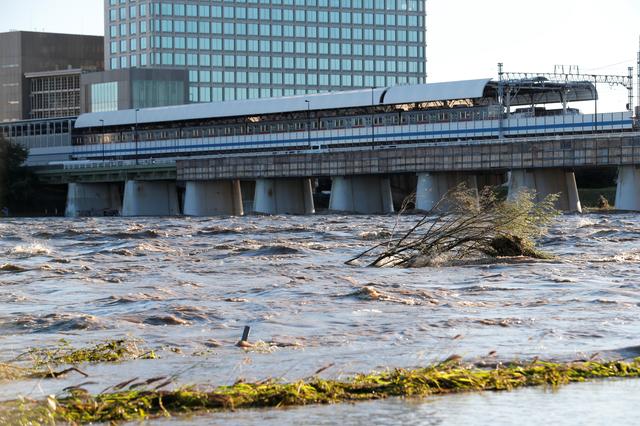 A view of Tama river, which reached flood risk level last night caused by Typhoon Hagibis, in Tokyo, Japan, October 13, 2019. REUTERS/Kim Kyung-Hoon