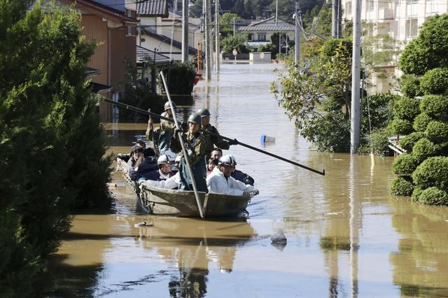 Local residents are rescued by Japapnese Defence-Force soldiers from a flooded area caused by Typhoon Hagibis in Kakuda, Miyagi prefecture, Japan, October 13, 2019, in this photo taken by Kyodo. Mandatory credit Kyodo/via REUTERS 
