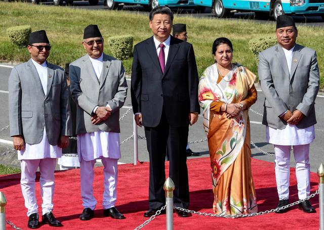 (L-R) Chairman of National Assembly of Nepal Ganesh Prasad Timilsina, Nepal's Prime Minister KP Sharma Oli, China's President Xi Jinping, Nepal's President Bidhya Devi Bhandari and Vice President Nanda Kishor Pun, look on as Xi Jinping is about to leave, wrapping up his two-day visit to Nepal, in Kathmandu on October 13, 2019. Prakash Mathema/Pool via REUTERS