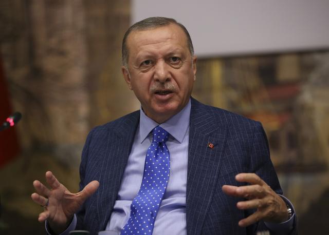 Turkish President Tayyip Erdogan talks to journalists in Istanbul, Turkey, October 13, 2019. Murat Kula/Presidential Press Office/Handout via REUTERS 
