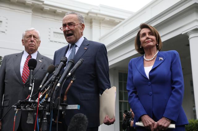 U.S. Senate Minority Leader Chuck Schumer (D-NY) speaks to reporters with House Majority Leader Steny Hoyer (D-MD) and House Speaker Nancy Pelosi (D-CA) after meeting with U.S. President Donald Trump at the White House in Washington, U.S., October 16, 2019.  REUTERS/Leah Millis