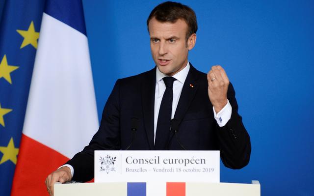 French President Emmanuel Macron gestures as he holds a news conference at the end of the European Union leaders summit dominated by Brexit, in Brussels, Belgium October 18, 2019. REUTERS/Johanna Geron