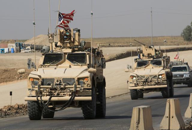 A convoy of U.S. vehicles is seen after withdrawing from northern Syria, at the Iraqi-Syrian border crossing in the outskirts of Dohuk,, Iraq, October 21, 2019. REUTERS/Ari Jalal