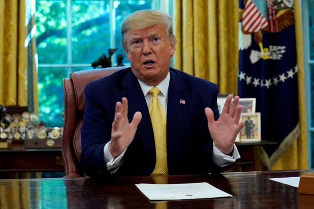 FILE PHOTO: U.S. President Donald Trump speaks during a meeting with China's Vice Premier Liu He in the Oval Office at the White House after two days of trade negotiations in Washington, U.S., October 11, 2019. REUTERS/Yuri Gripas/File Photo