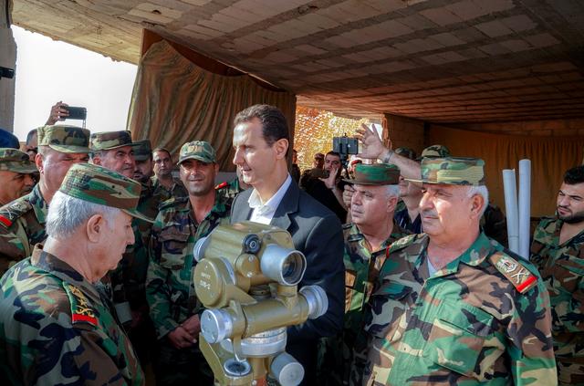 Syrian President Bashar al Assad visits Syrian army troops in war-torn northwestern Idlib province, Syria, in this handout released by SANA on October 22, 2019. SANA/Handout via REUTERS