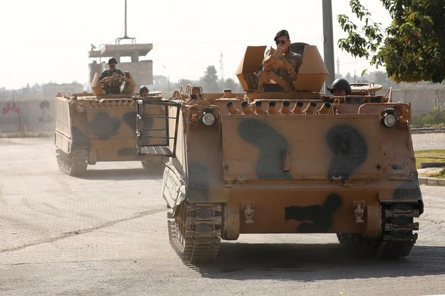 Turkish soldiers in armored vehicles return from the Syrian town of Tal Abyad, as they are pictured on the Turkish-Syrian border in Akcakale, Turkey, October 24, 2019. REUTERS/Huseyin Aldemir