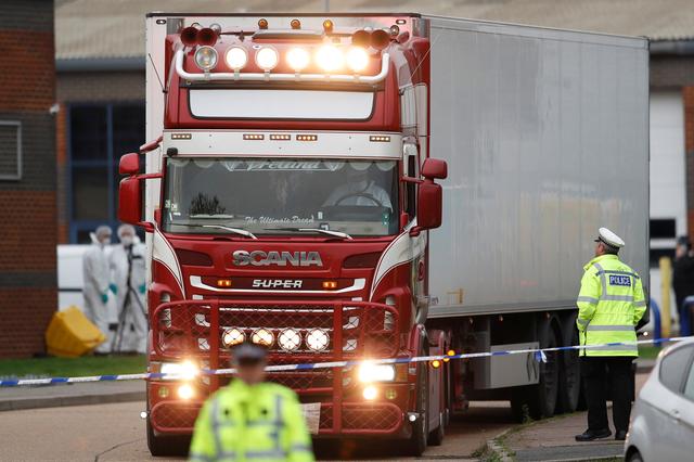 FILE PHOTO: Police move the lorry container where bodies were discovered, in Grays, Essex, Britain October 23, 2019.  REUTERS/Peter Nicholls/File Photo