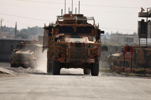 Turkish soldiers in military vehicles return from the Syrian town of Tal Abyad, as they are pictured on the Turkish-Syrian border in Akcakale, Turkey, October 24, 2019. REUTERS/Huseyin Aldemir