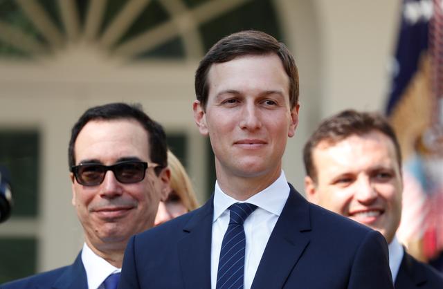 FILE PHOTO: White House senior advisor Jared Kushner (C) and Treasury Secretary Steven Mnuchin (L) wait in the Rose Garden prior to President Donald Trump's news conference on the United States-Mexico-Canada Agreement (USMCA) at the White House in Washington, U.S., October 1, 2018. REUTERS/Leah Millis/File Photo