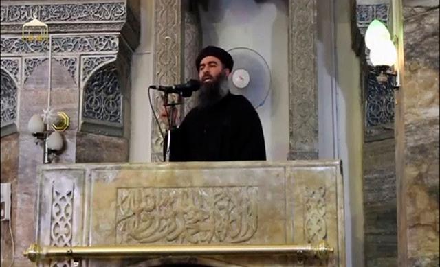 FILE PHOTO: A man purported to be the reclusive leader of the militant Islamic State Abu Bakr al-Baghdadi has made what would be his first public appearance at a mosque in the centre of Iraq's second city, Mosul, according to a video recording posted on the Internet on July 5, 2014, in this still image taken from video.  Social Media Website via Reuters TV/File Photo 