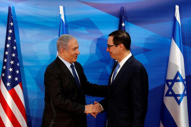 Israeli Prime Minister Benjamin Netanyahu and U.S. Treasury Secretary Steven Mnuchin shake hands as they deliver joint statements during their meeting in Jerusalem October 28, 2019. REUTERS/Ronen Zvulun