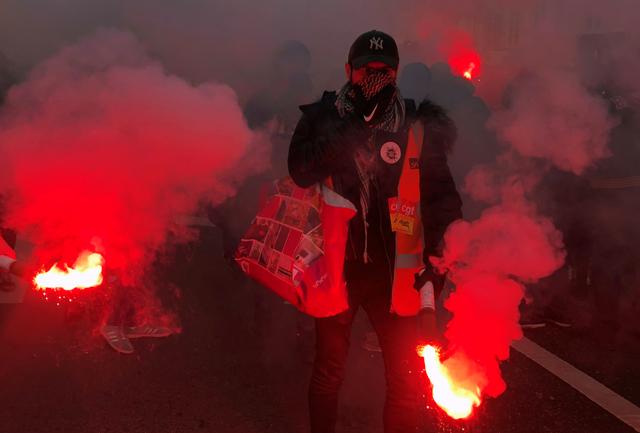 French SNCF railway workers on strike attend a demonstration in Paris as France faces its 13th day of consecutive strikes against French government's pensions reform plans, December 17, 2019.  REUTERS/Jean-Michel Belot