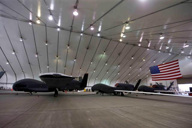 FILE PHOTO: U.S. Air Force RQ-4 Global Hawk aircraft wait in a hangar In a military installation at an Air Force Base in the Arabian Gulf, March 14, 2017. REUTERS/Hamad I Mohammed/File Photo