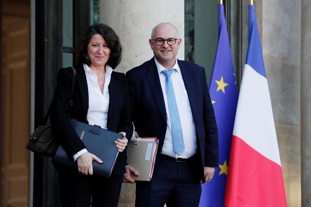 French Health and Solidarity Minister Agnes Buzyn and French High Commissioner for Pension Reform Laurent Pietraszewski leave the Elysee Palace following the weekly cabinet meeting in Paris, France, December 18, 2019. REUTERS/Benoit Tessier