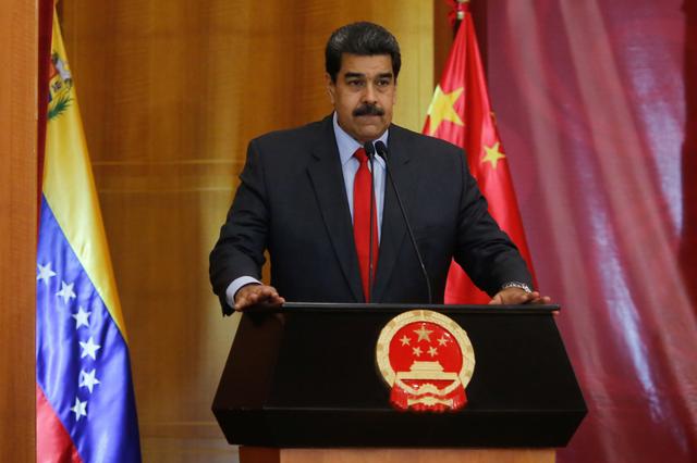 FILE PHOTO: Venezuela's President Nicolas Maduro takes part in a ceremony marking the 70th anniversary of the founding of the People's Republic of China in Caracas, Venezuela September 30, 2019. Miraflores Palace/Handout via REUTERS 
