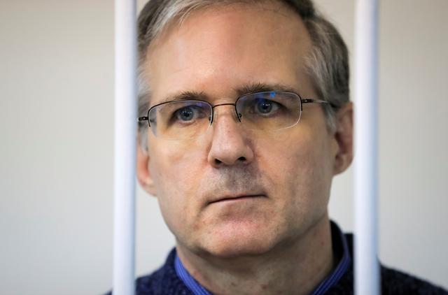 FILE PHOTO: Former U.S. Marine Paul Whelan, who was detained and accused of espionage, stands inside a defendants' cage during a court hearing on extending his pre-trial detention, in Moscow, Russia October 24, 2019.  REUTERS/Tatyana Makeyeva
