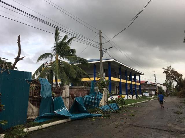 A man walks past damaged homes after Typhoon Phanfone swept through Tanauan, Leyte, in the Philippines December 25, 2019, in this photo obtained from social media. Paul Cinco/via REUTERS 