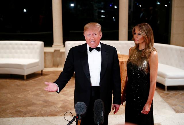 U.S. President Donald Trump accompanied by first lady Melania Trump, speaks to the press at the Mar-a-Lago resort in Palm Beach, Florida, U.S. December 31, 2019.    REUTERS/Tom Brenner