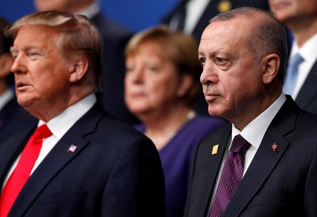 FILE PHOTO: U.S. President Donald Trump and Turkey's President Tayyip Erdogan pose for a family photo during the annual NATO heads of government summit at the Grove Hotel in Watford, Britain December 4, 2019.  REUTERS/Peter Nicholls/Pool