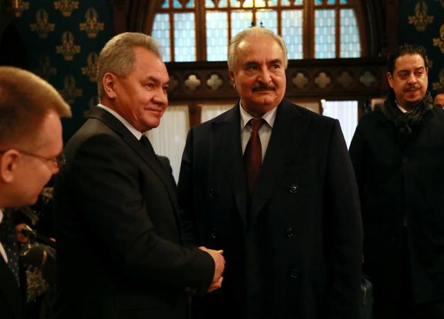 Commander of the Libyan National Army (LNA) Khalifa Haftar shakes hands with Russian Defence Minister Sergei Shoigu before talks in Moscow, Russia January 13, 2020. Ministry of Foreign Affairs of the Russian Federation/Handout via REUTERS 