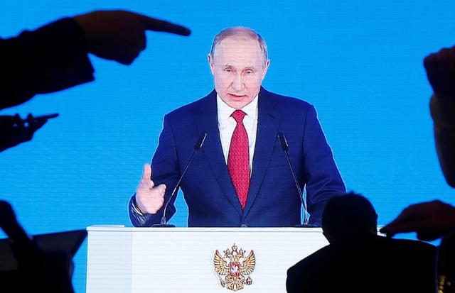 Russian President Vladimir Putin is seen on screen as he delivers his annual state of the nation address to the Federal Assembly in Moscow, Russia January 15, 2020. REUTERS/Maxim Shemetov
