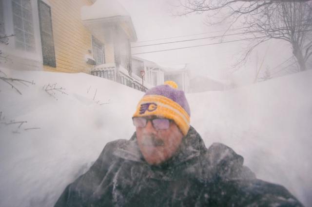 A man is pictured in a snowy street in St. John's, Newfoundland and Labrador, Canada January 17, 2020. Zach Bonnell/via REUTERS 
