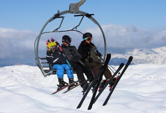 People ride a ski lift at Mzaar Ski Resort in Kfardebian, Lebanon January 11, 2020. REUTERS/Aziz Taher