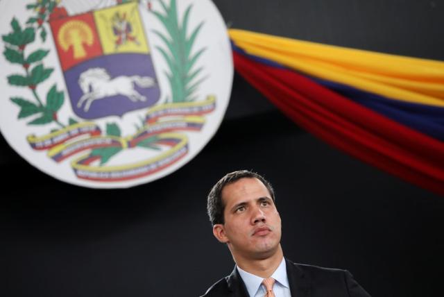 FILE PHOTO: Venezuela's National Assembly President and opposition leader Juan Guaido, who many nations have recognised as the country's rightful interim ruler, holds a session of Venezuela's National Assembly taking place in an amphitheatre in Caracas, Venezuela January 15, 2020. REUTERS/Manaure Quintero