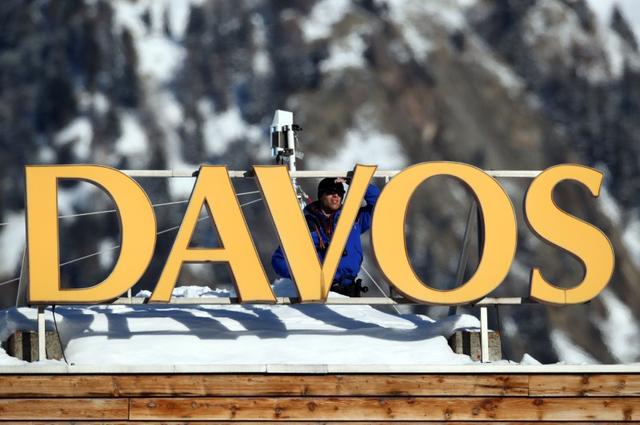 FILE PHOTO: A police officer stands guard near the Congress Center ahead of the World Economic Forum (WEF) annual meeting in Davos, Switzerland January 20, 2020. REUTERS/Denis Balibouse