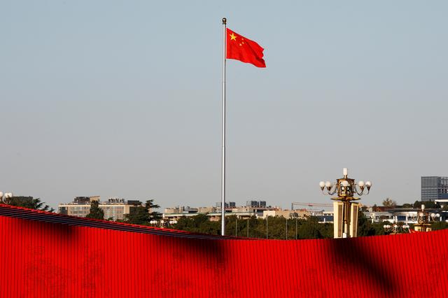 FILE PHOTO: A Chinese flag flutters at the Tiananmen Square in Beijing, China October 25, 2019. REUTERS/Florence Lo/File Photo - RC2LJE9RAKHZ