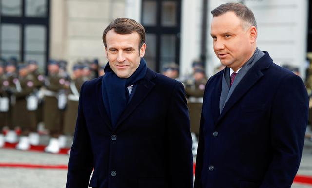French President Emmanuel Macron and Polish President Andrzej Duda attend the welcoming ceremony in Warsaw, Poland February 3, 2020. REUTERS/Kacper Pempel