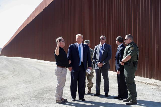 FILE PHOTO: U.S. President Donald Trump visits a section of the U.S.-Mexico border wall in Otay Mesa, California, U.S. September 18, 2019. REUTERS/Tom Brenner/File Photo