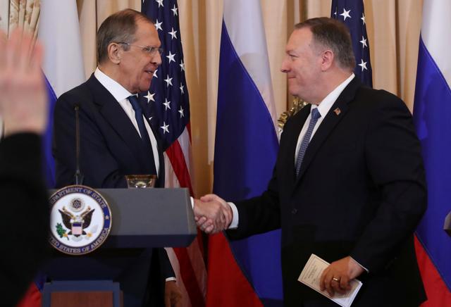 Russia’s Foreign Minister Sergey Lavrov and U.S. Secretary of State Mike Pompeo shake hands at the conclusion of a joint news conference at the State Department in Washington, U.S., December 10, 2019. REUTERS/Jonathan Ernst