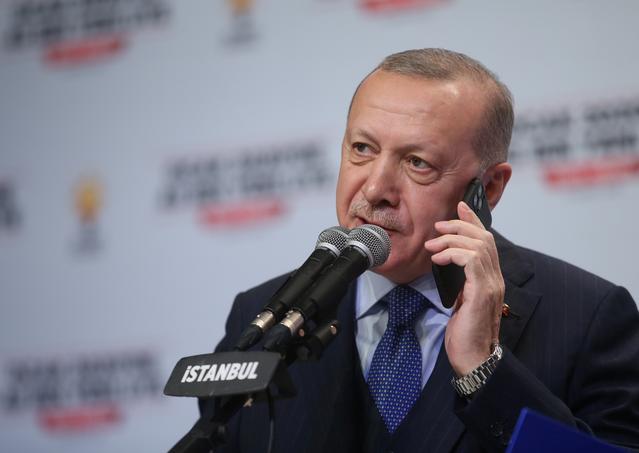 FILE PHOTO: Turkish President Tayyip Erdogan talks to phone as he addresses his ruling AK Party members in Istanbul, Turkey, February 15, 2020. Murat Cetinmuhurdar/Presidential Press Office/Handout via REUTERS THIS IMAGE HAS BEEN SUPPLIED BY A THIRD PARTY.   NO RESALES. NO ARCHIVES